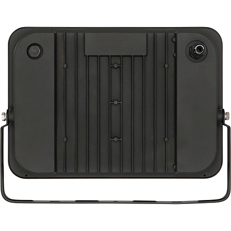 Gros plan d'une surface noire et angulaire avec une vis. Un élément vert est au centre de la vis.