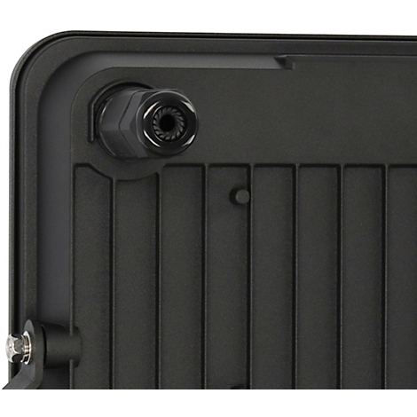 Gros plan d'une lampe noire. On peut voir un élément rond avec un filetage et une surface nervurée.