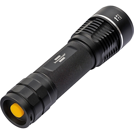 Cercle rouge avec texte blanc FOCUS, à côté un symbole blanc pour le réglage de la mise au point.