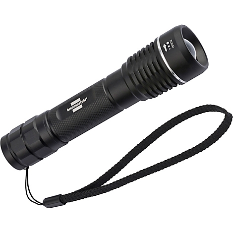 Lampe de poche noire avec dragonne. Zoom est écrit sur la tête. "brennenstuhl" est écrit sur le corps.