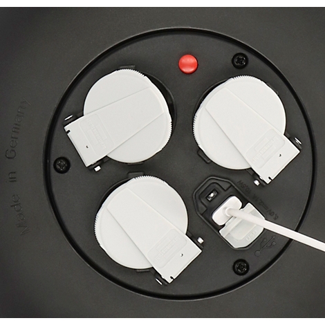 Enrouleur de câble noir avec prises et voyant rouge. Avec poignée et prise.