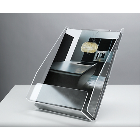 Transparent brochure holder with a picture of a kitchen, standing on a white table.
