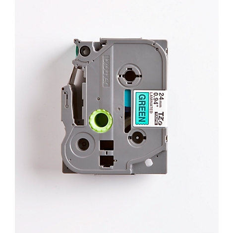 A gray label tape dispenser marked in green. Inscription: „GREEN“ and „24mm 0.94“.