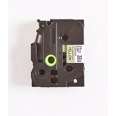 A black label tape, partially with yellow and green accents. On the side is a white label with yellow text.