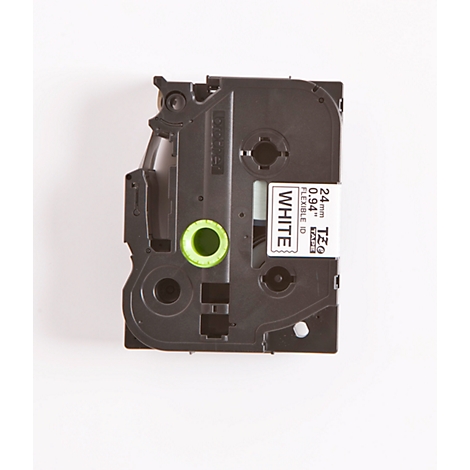 Black label tape on a white background. Printed: WHITE, 24mm, 0.94". A green circle is at the bottom.