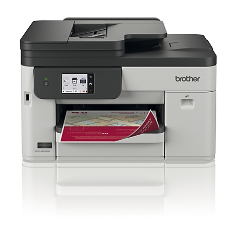 Kompakter Brother Multifunktionsdrucker in Grau und Schwarz mit Touchscreen und bedrucktem Blatt im Ausgabefach.