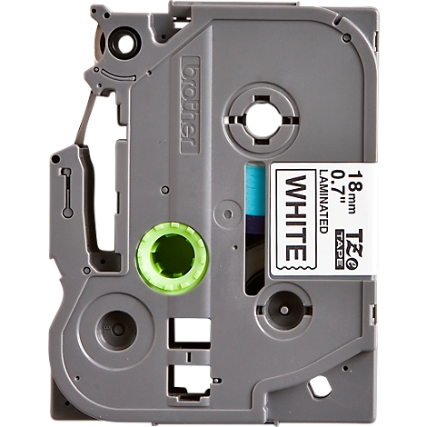 A grey Brother label cassette. Printed on it is the inscription "WHITE", as well as "18mm 0.7" Laminated TZe Tape".