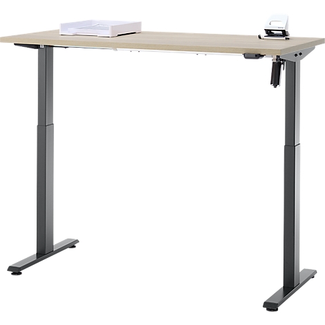 Lichtgekleurde in hoogte verstelbare bureau met twee grijze poten. Op het tafelblad liggen een lade en een perforator.