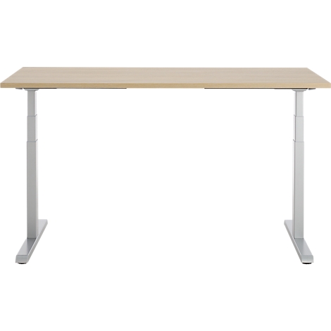 In hoogte verstelbaar bureau van licht hout met zilveren poten.