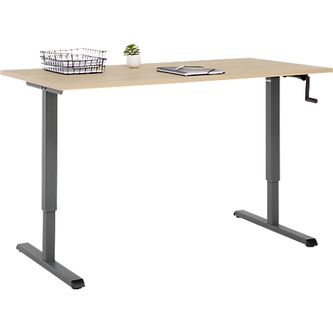 Bureau réglable en hauteur avec du bois clair et des pieds gris. Sur le dessus de la table, un panier, une plante et un bloc-notes.