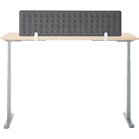 Bureau met grijze geluiddichte muur met knoppen. Het bureau heeft in hoogte verstelbare poten.