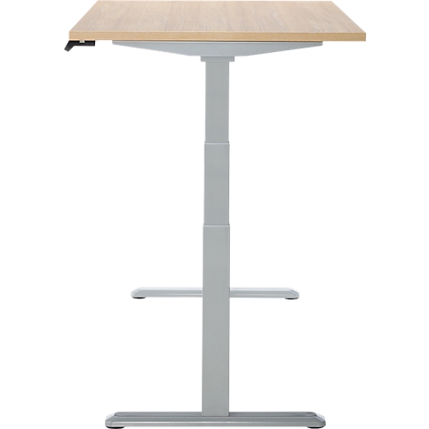 Un bureau debout avec un plateau de table brun clair, un cadre gris et deux repose-pieds.
