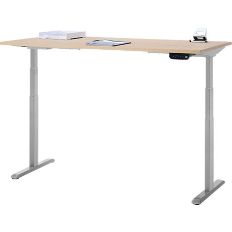 Bureau réglable en hauteur en bois clair avec pieds argentés. Papier, tablette et téléphone sont sur la surface.