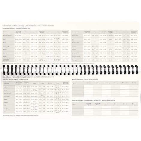 Kalender met vakantiedata, spiraalgebonden, lichtgrijs. Tabellen met kolommen voor data en vakantieregio's.