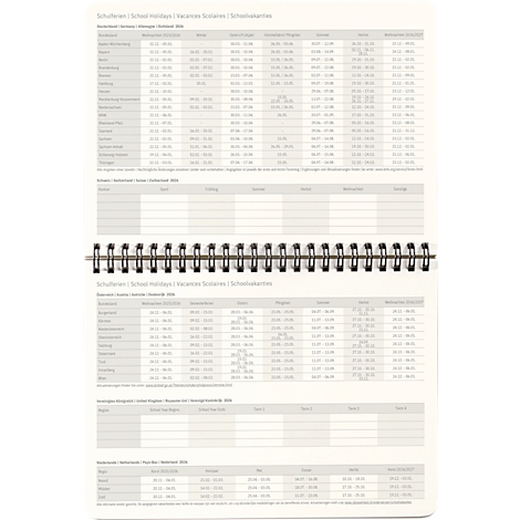 Opengevouwen notitieboek met een tabel. Kop: Schoolvakanties. Kolommen voor datum en vakantieplaatsen. Spiraalbinding.