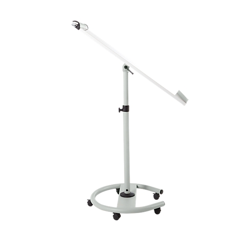 A white, height-adjustable stand-up desk with castors. The shelf is sloped.