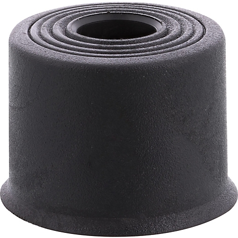 Objet cylindrique noir avec des marches sur le dessus et un renfoncement.