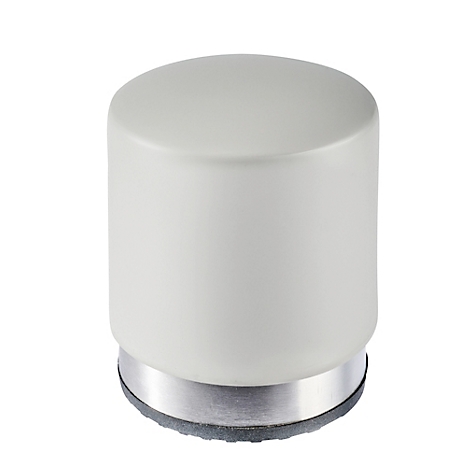 Objet cylindrique blanc avec anneau argenté à la base, posé sur une surface grise.