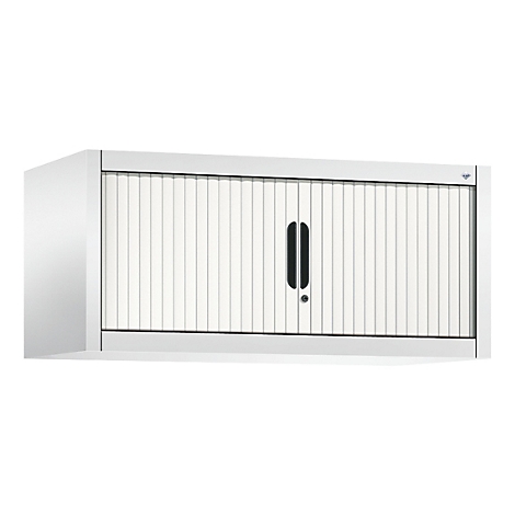 Armoire murale blanche avec porte à lamelles et poignée noire. L'armoire est fixée au mur.