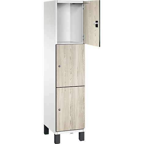 Hoge kast, twee deuren, bovenste deur open. Houtlook, grijze poten.