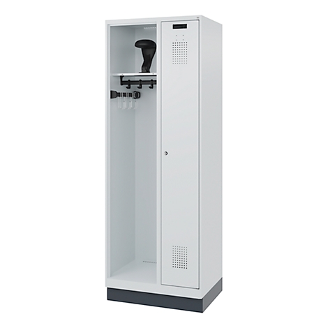 White locker, door perforated, with shelf, hook strip. A black club in the niche. A base below the door.