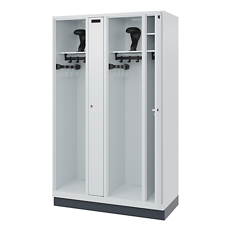 White locker with open door and two black helmets.