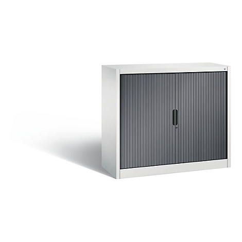Gray roller shutter cabinet with handle. Stands against a white background, with shadows.