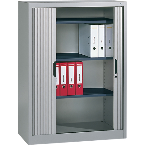 Gray filing cabinet with roller shutter. Inside are folders in red and white on shelves.