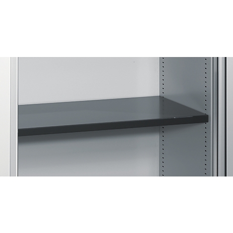 Dark gray shelf in a light gray cabinet. The cabinet has rows of holes on the sides for adjusting the height of the shelves.