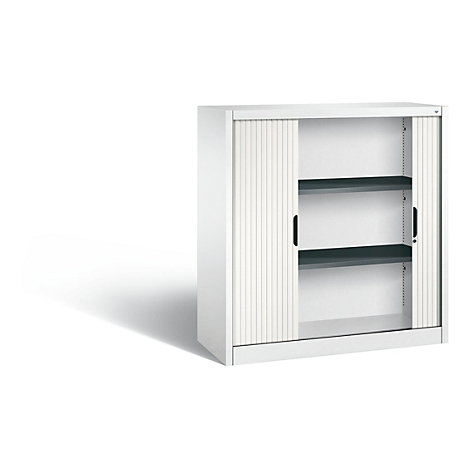 White tambour door cabinet with two gray shelves, open door, light background.