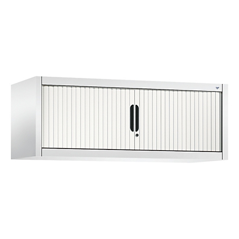 Hängeschrank mit Rollladen. Weiße Oberfläche mit schwarzen Griff und vertikalen Lamellen.