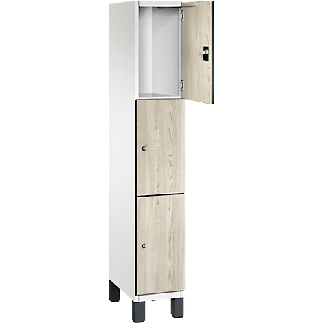 Schrank mit zwei Fächern und einer geöffneten Tür, Holzoptik, helles Holz, weißes Gehäuse.