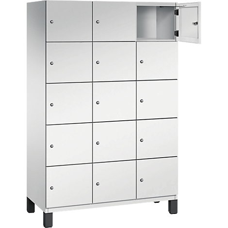 Weißer Schrank mit 12 Fächern, ein Fach geöffnet.