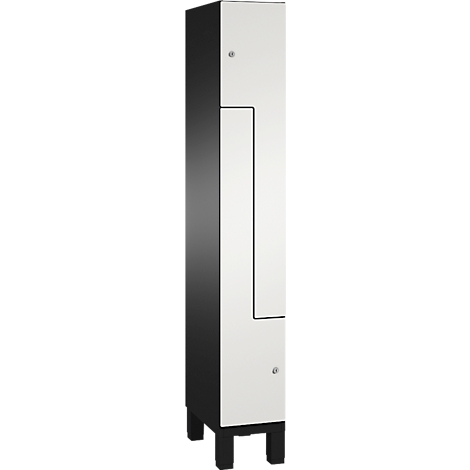 Kast met zwarte zijkanten, witte voorkant en vier zwarte poten. Kleine zilveren handgrepen.