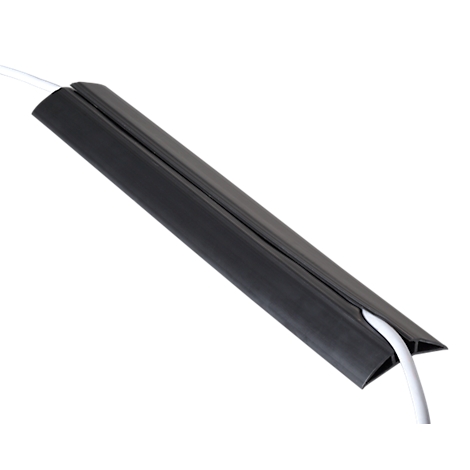 Black cable duct with white cables. The angle runs diagonally from the top left to the bottom right. The cables emerge at the end of the duct.