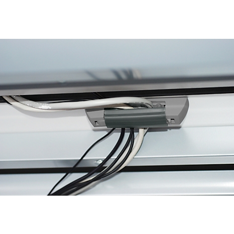 Gray cable duct with cables, white panels above and below, black frame.