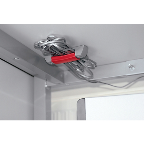 Silver cables held by a red band, attached to the ceiling. Bright environment.
