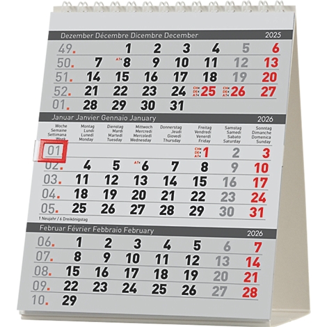 Un calendrier de bureau affichant les calendriers de décembre 2025, janvier et février 2026. Le premier janvier est mis en évidence en rouge.