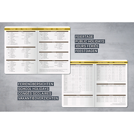 Carnet ouvert avec des aperçus des vacances et des jours fériés, ainsi que des pages de calendrier sur fond gris.