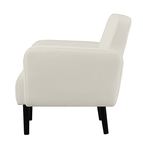 Fauteuil crème en profil. Pieds noirs, forme arrondie. Style moderne.