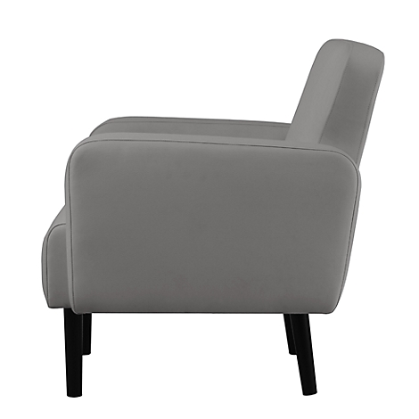 Fauteuil gris de profil avec pieds noirs.