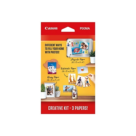 Canon Pixma Kreativ-Set mit verschiedenen Fotopapier-Arten und Anwendungsbeispielen an einer gelben Wand.