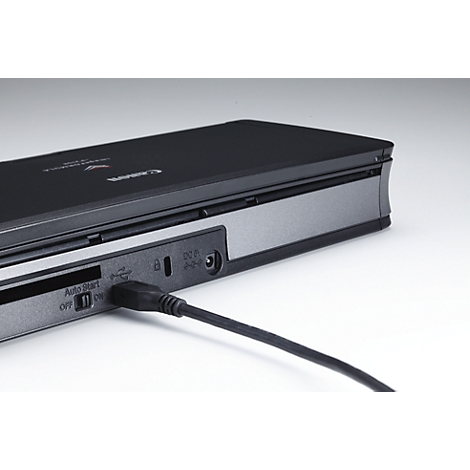 Close-up of a black Canon device with connected cable, SD card slot, and on/off switch.
