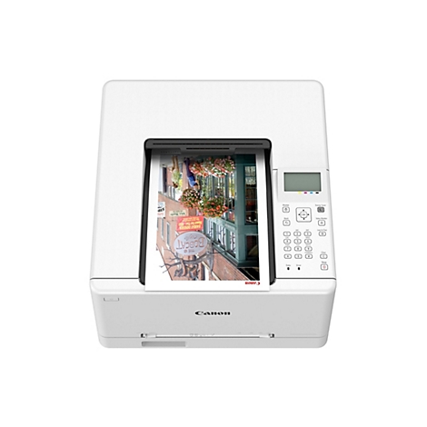 Weißer Canon Drucker mit Ausdruck. Auf dem Ausdruck ist ein Restaurant mit Blumenkästen vor den Fenstern zu sehen.