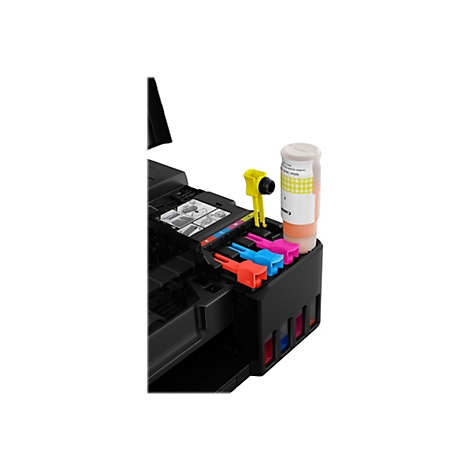 Gros plan d'une imprimante à jet d'encre avec le couvercle ouvert. Contenants d'encre jaunes, bleus, roses et rouges. Une bouteille d'encre jaune avec l'étiquette "Yellow" est à côté de l'imprimante.