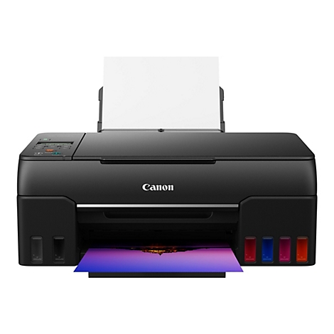 Imprimante Canon noire avec papier blanc. L'image imprimée est en cours de sortie. Les couleurs des cartouches d'encre sont visibles.
