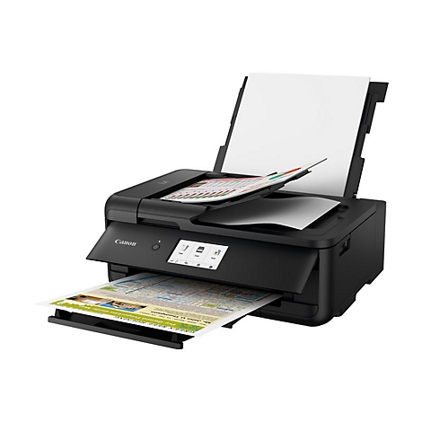 Schwarzer Canon-Drucker druckt Dokumente aus. Oben liegt ein leeres weißes Papier, im Ausgabefach ein Stadtplan.