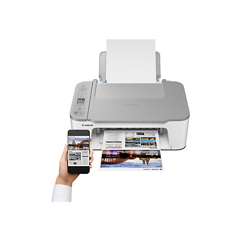 Ein Drucker druckt ein Blatt Papier aus, neben einem Smartphone.