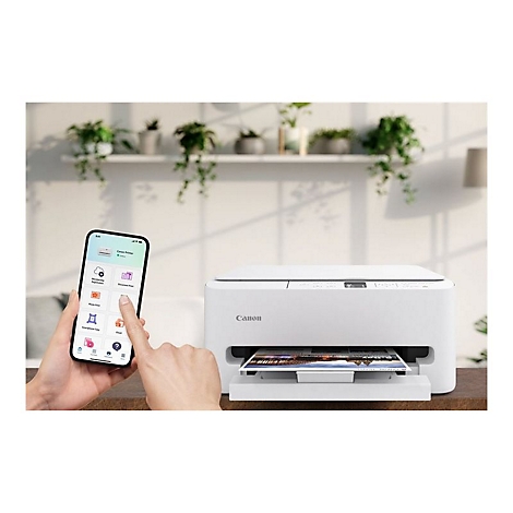 Weiße Canon Drucker mit Smartphone App-Anzeige, die ein Foto druckt. Im Hintergrund Grünpflanzen auf einem Regal.