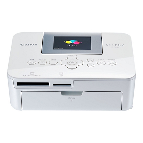 Ein weißer Canon Selphy CP1000 Fotodrucker. Mit kleinem Bildschirm, Bedientasten und Kartenslots.